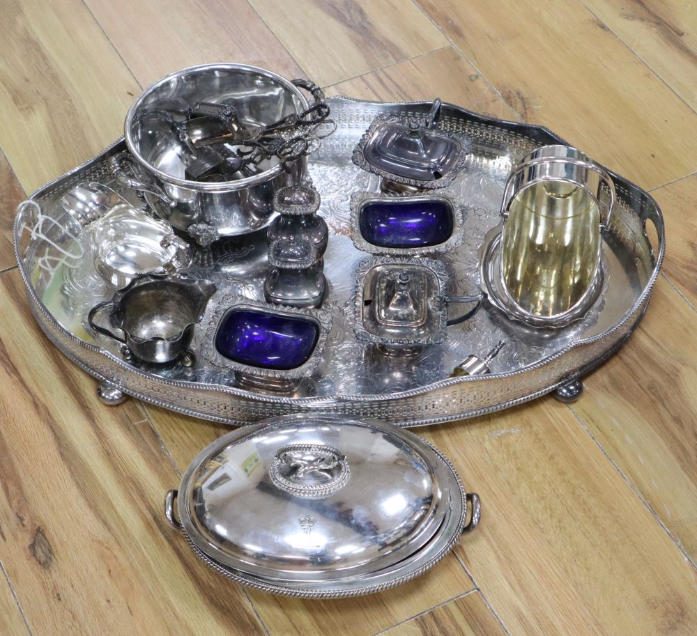 A large oval plated galleried tray and a collection of plated items,